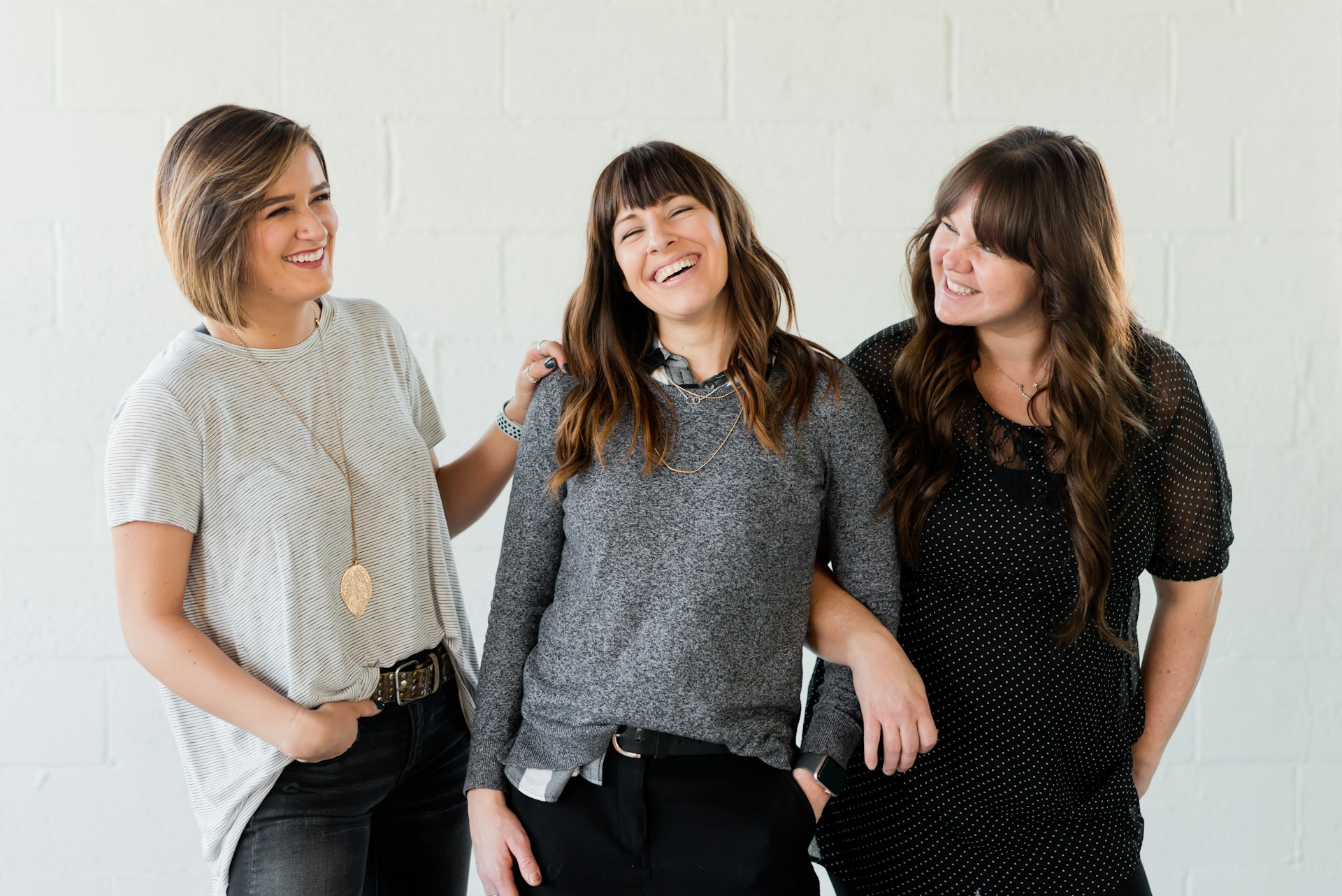 A group of women smiling together