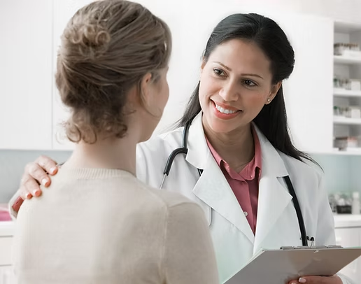 Doctor comforting a patient during a consultation